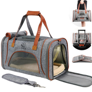 Pet carrier with brown accents and a visible brand logo on a white background