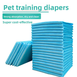 Stack of blue pet training diapers with text highlighting features on a white background